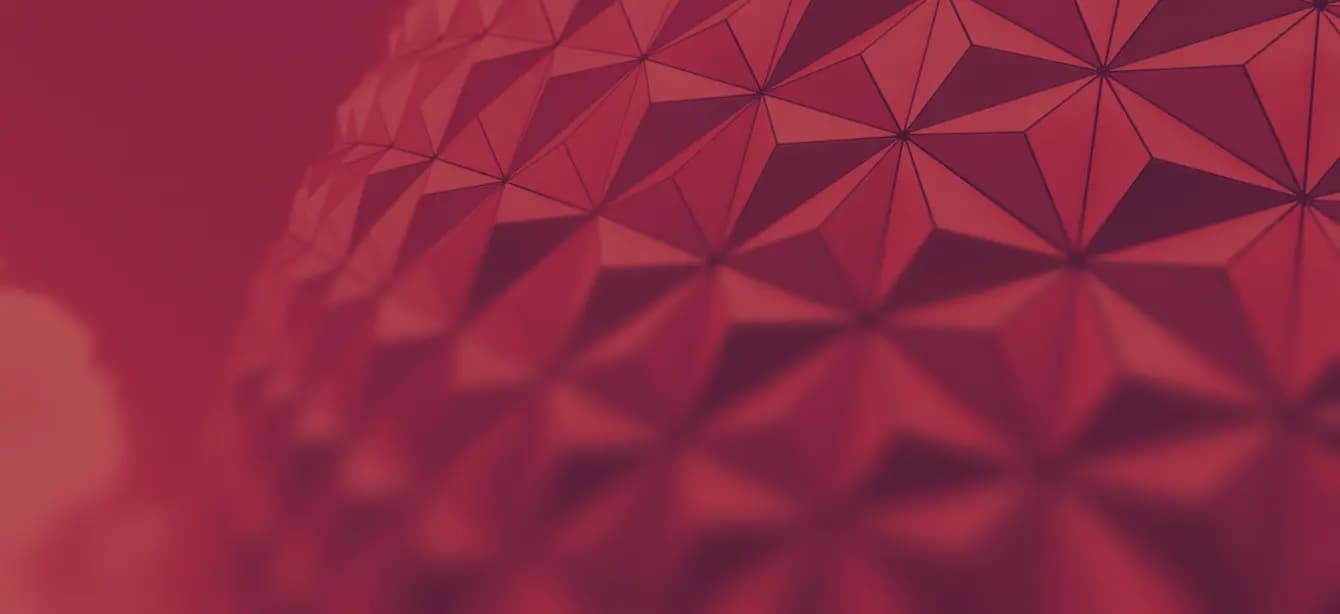 Abstract red geometric pattern with triangular shapes forming a 3D textured surface.